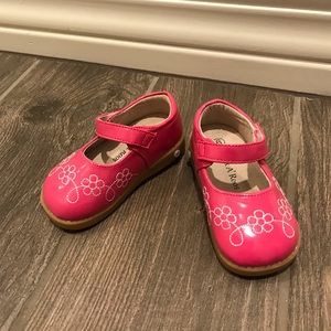 Sneak-a-Roos pink Mary Jane shoes.